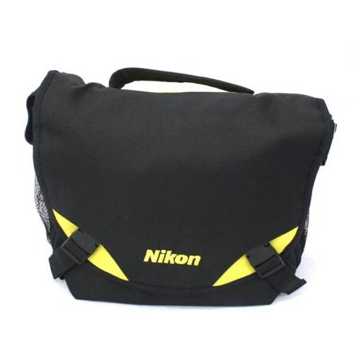 The Nikon Bag Black is a camera bag designed for use with a Nikon DSLR and NIKKOR lens or lenses and has compartments for small accessories and two removable dividers that allow you to configure the bag for your needs. The bag features a front pocket with a zipper and a Velcro closure on the front. The Nikon Bag Yellow comes with a shoulder strap with added protection for greater comfort during use. The bag is black with yellow features on the outside and black on the inside.